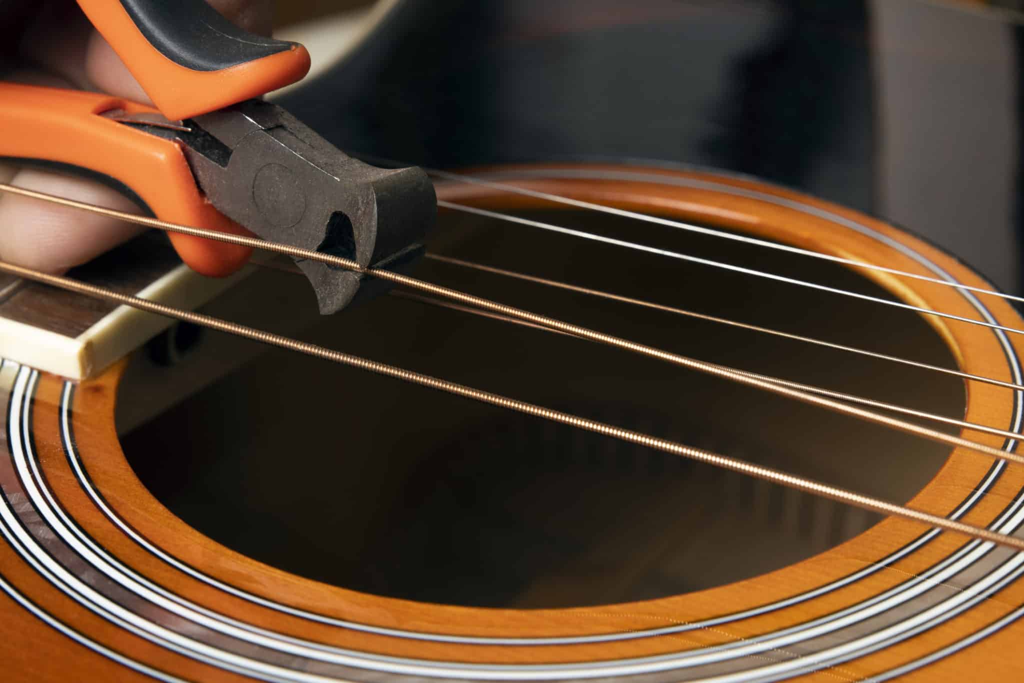 should-guitar-strings-be-cut-guitar-in-demand