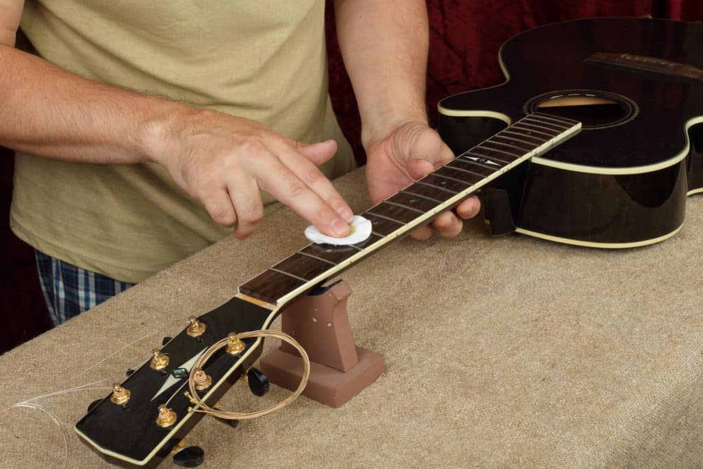 oiling a guitar